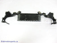 Used Honda ATV TRX 350 FM OEM part # 15600-HM7-610 OR 15600HM7610 oil cooler for sale