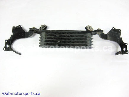 Used Honda ATV TRX 350 FM OEM part # 15600-HM7-610 OR 15600HM7610 oil cooler for sale