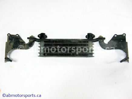 Used Honda ATV TRX 350 FM OEM part # 15600-HM7-610 OR 15600HM7610 oil cooler for sale