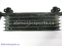 Used Honda ATV TRX 350 FM OEM part # 15600-HM7-610 OR 15600HM7610 oil cooler for sale