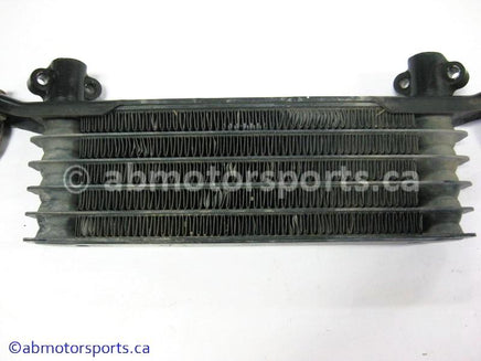 Used Honda ATV TRX 350 FM OEM part # 15600-HM7-610 OR 15600HM7610 oil cooler for sale