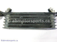 Used Honda ATV TRX 350 FM OEM part # 15600-HM7-610 OR 15600HM7610 oil cooler for sale