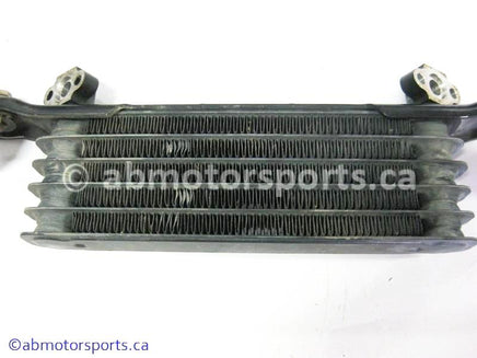 Used Honda ATV TRX 350 FM OEM part # 15600-HM7-610 OR 15600HM7610 oil cooler for sale