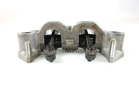 A used Rocker Arm Holder from a 2001 TRX450ES Honda OEM Part # 14411-HM7-000 for sale. Honda ATV parts online? Shop our online catalog!!