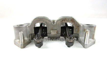 A used Rocker Arm Holder from a 2001 TRX450ES Honda OEM Part # 14411-HM7-000 for sale. Honda ATV parts online? Shop our online catalog!!