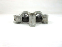 A used Rocker Arm Holder from a 2001 TRX450ES Honda OEM Part # 14411-HM7-000 for sale. Honda ATV parts online? Shop our online catalog!!