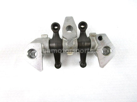 A used Rocker Arm Holder from a 2001 TRX450ES Honda OEM Part # 14411-HM7-000 for sale. Honda ATV parts online? Shop our online catalog!!