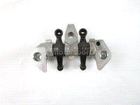 A used Rocker Arm Holder from a 2001 TRX450ES Honda OEM Part # 14411-HM7-000 for sale. Honda ATV parts online? Shop our online catalog!!