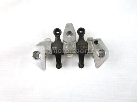 A used Rocker Arm Holder from a 2001 TRX450ES Honda OEM Part # 14411-HM7-000 for sale. Honda ATV parts online? Shop our online catalog!!
