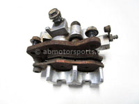 Used 2009 Kawasaki Teryx 750 LE OEM part # 43080-0080 right front brake caliper for sale