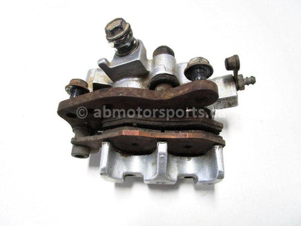 Used 2009 Kawasaki Teryx 750 LE OEM part # 43080-0080 right front brake caliper for sale