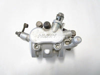 Used 2009 Kawasaki Teryx 750 LE OEM part # 43080-0080 right front brake caliper for sale