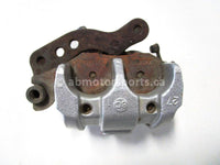 Used 2009 Kawasaki Teryx 750 LE OEM part # 43080-0080 right front brake caliper for sale