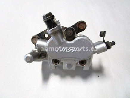 Used 2009 Kawasaki Teryx 750 LE OEM part # 43080-0079 front left brake caliper for sale
