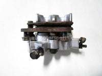 Used 2009 Kawasaki Teryx 750 LE OEM part # 43080-0079 front left brake caliper for sale