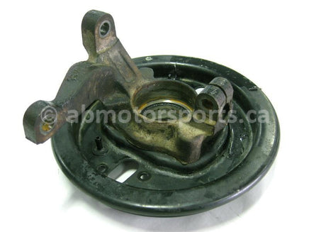 Used Yamaha ATV KODIAK 400 OEM part # 3HN-23501-01-00 left hand steering knuckle and backing plate for sale