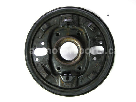 Used Yamaha ATV KODIAK 400 OEM part # 3HN-23501-01-00 left hand steering knuckle and backing plate for sale