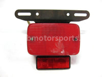 Used Yamaha ATV KODIAK 400 OEM part # 52H-84710-00-00 OR 21V-84710-00-00 tail light for sale