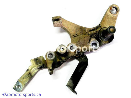 Used Yamaha ATV GRIZZLY 660 OEM part # 5KM-27263-00-00 foot brake bracket for sale