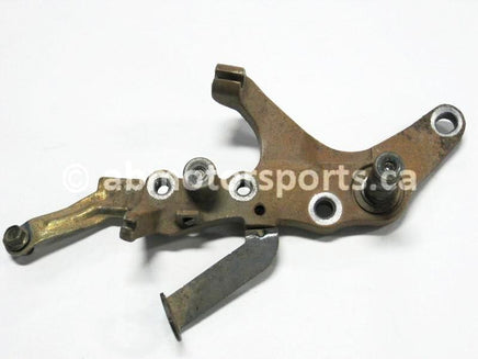 Used Yamaha ATV GRIZZLY 660 SE OEM part # 5KM-27263-00-00 rear brake mount bracket for sale