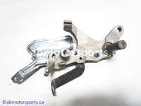 Used Yamaha ATV GRIZZLY 660 OEM part # 5KM-27263-00-00 rear brake mount for sale