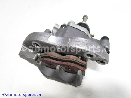Used Yamaha ATV YFZ450 OEM part # 5TG-2580W-20-00 rear brake caliper for sale