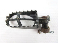A used Foot Peg L from a 2006 WR250F Yamaha OEM Part # 5ET-27411-00-00 for sale. Yamaha dirt bike parts… Shop our online catalog… Alberta Canada!