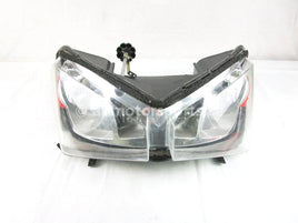 A used Headlight from a 2005 FUSION 900 Polaris OEM Part # 2410377 for sale. Online Polaris snowmobile parts in Alberta, shipping daily across Canada!