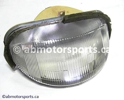 Used Arctic Cat Snow 580 EXT OEM part # 0609-172 head light for sale