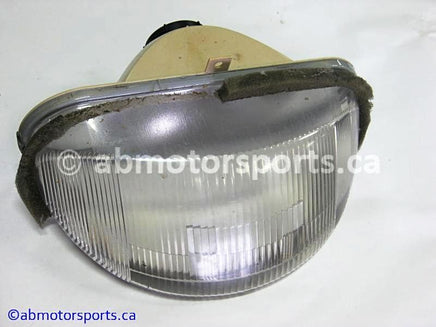 Used Arctic Cat Snow 580 EXT OEM part # 0609-172 head light for sale