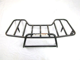 A used Rear Rack from a 2000 TRAXTER 500 7415 Can Am OEM Part # 705000210 for sale. Looking for Can Am ATV parts near Edmonton? We ship daily across Canada!