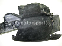 Used Honda ATV TRX 680 FA OEM part # 61867-HN8-000ZA and 61864-HN8-000 left inner fender with splash guard for sale