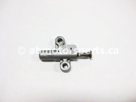 Used Honda ATV TRX 350 FM2 OEM part # 14540-HN5-671 tensioner adjuster for sale