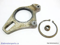 Used Honda ATV TRX 400EX OEM part # 43211-HN1-000 rear caliper bracket for sale