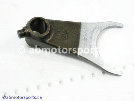 Used Honda ATV TRX 400FW OEM part # 24211-HM7-000 front gearshift fork for sale