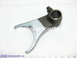 Used Honda ATV TRX 300 FW OEM part # 24212-HC4-000 center shift fork for sale