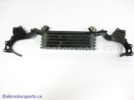 Used Honda ATV TRX 350 FM OEM part # 15600-HM7-610 OR 15600HM7610 oil cooler for sale