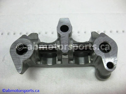 Used Honda ATV TRX 350 FM OEM part # 14411-HN5-670 OR 14411HN5670 rocker arm holder for sale 
