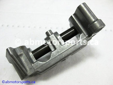 Used Honda ATV TRX 350 FM OEM part # 14411-HN5-670 OR 14411HN5670 rocker arm holder for sale 
