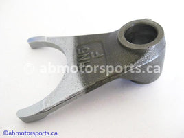 Used Honda ATV TRX 350 FM OEM part # 24211-HN5-670 OR 24211HN5670 front gearshift fork for sale 
