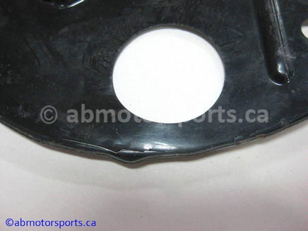 Used Kawasaki Bayou 400 OEM Part # 55020-1304 left disc brake cover for sale