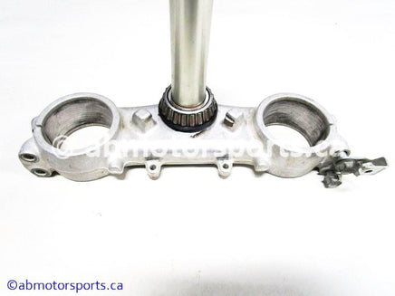 Used Kawasaki Dirt Bike KX 125 OEM part # 44037-1371 fork clamp for sale