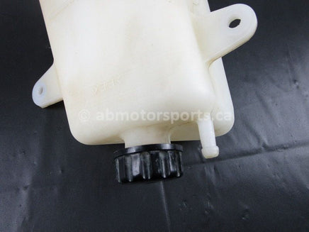 A used Coolant Reservoir from a 2009 TERYX 750LE Kawasaki OEM Part # 43078-0041 for sale. Looking for Kawasaki parts near Edmonton? We ship daily across Canada!