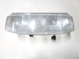 A used Headlight from a 1997 RMK 500 Polaris OEM Part # 2431008 for sale. Check out our online catalog for more parts that will fit your unit!
