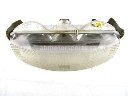 A used Headlight from a 2000 RMK 600 Polaris OEM Part # 2433016 for sale. Check out our online catalog for more parts that will fit your unit!