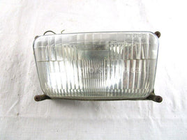 A used Head Light from a 1990 TRAIL Polaris OEM Part # 4032038 for sale. Check out Polaris snowmobile parts in our online catalog!