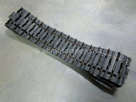 A used 15 inch X 156 inch Camoplast Sled Track Part # 679-9808 for sale. Check out our online catalog for more parts that will fit your unit!