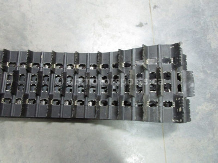 A used 16 inch X 154 inch 2.25 inch paddle Camoplast Sled Track OEM part # 504152800 for sale. Check out our online catalog for more parts that will fit your unit!