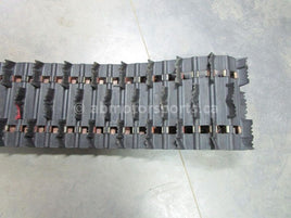 A used 15 inch X 156 inch with a 2 inch paddle Camoplast Sled Track for sale. Check out our online catalog for more parts that will fit your unit!