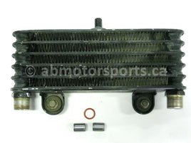 Used Yamaha ATV KODIAK 400 OEM part # 4GB-13470-00-00 oil cooler assembly for sale
